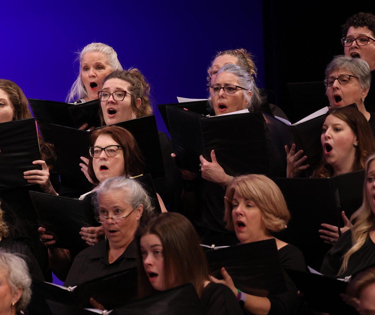 the soprano and alto section singing a concert in the gahanna community chorus