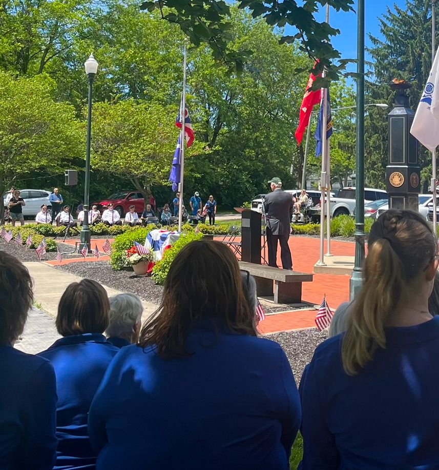 the Gahanna Community Chorus attending a memorial day service after singing patriotic songs in remembrance